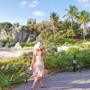 Young Woman Walking The Historical Archaeological Zone In Tulum, Quintana Roo, Mexico