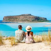 Couple Looking Out At Balo Beach, Crete, Greece